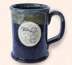 Collectible Thor ceramic tall coffee mug by Tom Thordarson features an original artwork 'Maiden Mast' engraved with a mermaid emblem.