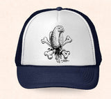 Navy and white Hawaii trucker hat featuring Tom Thordarson's black and white artwork of a tropical parrot sitting on crossbones.